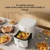 Kitchen view of Xiaomi Air Fryer Essential 6L open drawer holding whole chicken with plates of food around.