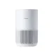 Angled view of Xiaomi Smart Air Purifier 4 Compact with cylindrical white design and perforated lower section.