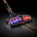 Front view of Dyson V16 Piston Vacuum Cleaner head showing dual rotating brushes lifting long hair into transparent housing.