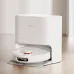 Docking view of Xiaomi X20 Robot Vacuum Cleaner charging in sleek station with minimalist circular design.