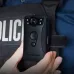 Close-up of a police uniform with a Transcend DrivePro Body 30 attached, showing lens, IR LEDs, and officer interaction.