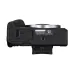 Bottom view of Canon EOS R50 Mirrorless Camera showing battery/card compartment, tripod mount, and product label.