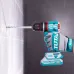 Action shot of TOTAL TIDLI205581 Drill Machine drilling into tiled wall with torque ring visible and gloves in use.