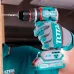 Workshop view of TOTAL TIDLI20668 Drill Machine driving a screw into wood with torque ring settings visible.