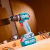 Workbench view of TOTAL TIDLI20768 Drill Machine placed with drill bits, safety glasses, and wood pieces.