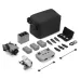 A complete grayscale shot of the DJI Mini 5 Pro Fly More Combo, with the drone, controller, batteries, charging hub, and carrying case laid out.