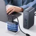 Desk view of the Baseus Union Joy Pro 17‑Port 4 Screen Docking Station connected to a laptop and charger during use.