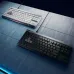 Top view of white and black Logitech G515 RAPID TKL Keyboard units side by side with vivid RGB backlighting.