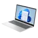 A light silver HP 15-fr0077TU laptop shown open at an angle, displaying the Windows 11 desktop on a bright screen.