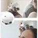 Usage view of Smart Scalp Massager with four rotating brush heads applied to scalp for relaxation and stimulation.