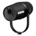 Rear angled view of the black Shure MV7X broadcast microphone showing the XLR connector port.