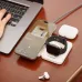 White Verbatim WCDQi201 3-in-1 charger with phone, watch, and earbuds charging.