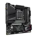 Gigabyte Z790M AORUS ELITE AX board showing CPU socket, RAM slots, PCIe, M.2 connectors, and AORUS branding