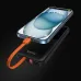 Black BWOO BO-P60 power bank charging a smartphone via its integrated orange cable, with the phone screen lit up.