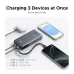 Overhead view of the Ugreen PB536 20000mAh 45W Power Bank #55988B charging three devices simultaneously via its dual USB‑C and USB‑A ports.