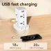 A white Deli power tower on a wooden desk with a phone plugged in for USB fast charging.