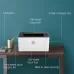 Desk setup with HP Laser 108A Laser Printer emphasizing fast output, 150-sheet input tray, and best-in-class security.