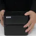 Front close view of the Xprinter XP‑410B Thermal Label Printer held by both hands for size reference.