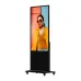 Angled view of Hikvision DS-D6055UN-D/S Signage with tall vertical screen on stand displaying person in bright yellow blazer.