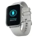 A silver smartwatch with a light gray silicone band. Its screen shows a glowing blue battery icon and 