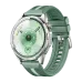 Overhead view of Huawei Watch GT 6 in green band showing digital metrics for distance, time, and heart rate on sporty display.