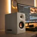 Desk setup view of the Edifier MR5 2:0 Tri‑amped Powered Studio Monitor Speaker in white beside a computer monitor.