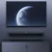 Front room setup view of the F&D HT‑200 2.0 Channel Bluetooth Soundbar placed below a wall‑mounted television.