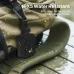 Monster Atomic Atom Portable Bluetooth Speaker clipped to a wet backpack strap, showing IPX5 water resistance in rain.