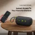 Front tabletop view of Oraimo SpaceBox Active Bluetooth Speaker beside phone showing FM radio interface.