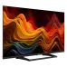 Front angled view of Haier H32S80GFX 32 QLED FHD Android Google TV displaying vibrant abstract waves on slim bezel screen with stand base