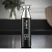 Upright close-up of Kemei KM-779 Hair Trimmer in sleek metallic black design with silver blade top.
