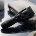 Product view of Panasonic ER-GB37 Trimmer on towel highlighting wet/dry use and adjustable length dial.