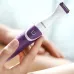 Close-up of Philips BRT383/15 Trimmer in hand, showing sleek purple and white design with central power button and fine blades.