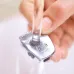 Close-up of Philips MG3747/13 Trimmer blades rinsed under running water, highlighting washable and easy-clean maintenance.