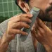 Usage view of Philips MG3911/15 3000 Series Trimmer applied along jawline for precise facial hair grooming.