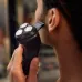 Close-up of Philips X3021/00 Shaver with pop-up trimmer extended, grooming sideburns for precise detailing.