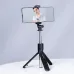 Havit ST7033 Bluetooth Selfie Stick Tripod shown holding a smartphone in tripod mode for hands-free shooting.