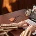 Desk‑level view of the Boya Notra AI Voice Recorder placed beside a laptop while audio recording is in progress.